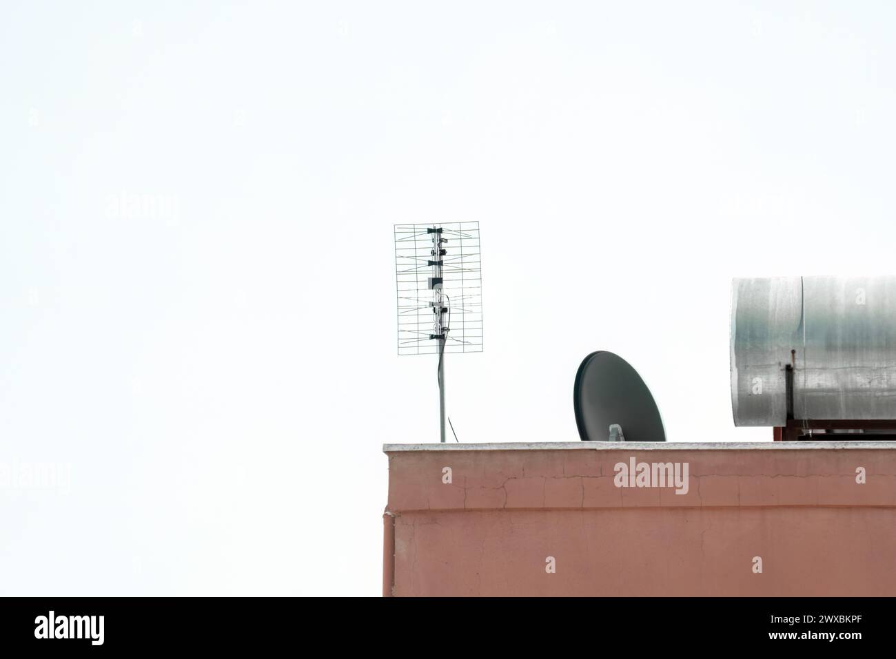 TV antenna on an apartment building. Stock Photo