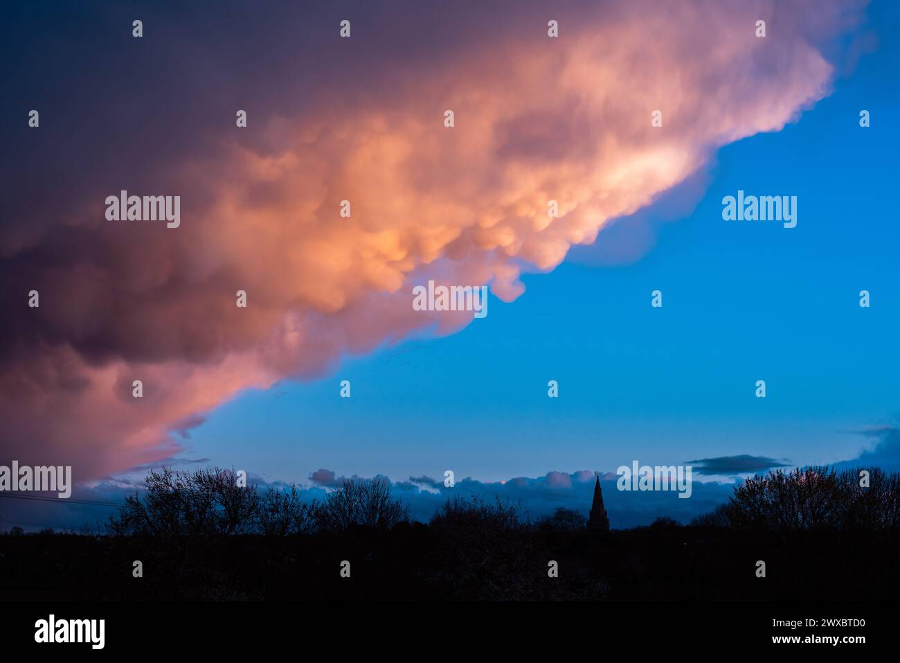 Bingham, Nottinghamshire, UK. 29th March, 2024.  A general view of mammatus clouds at sunset over Bingham, Nottingham. Neil Squires/Alamy Live News Stock Photo