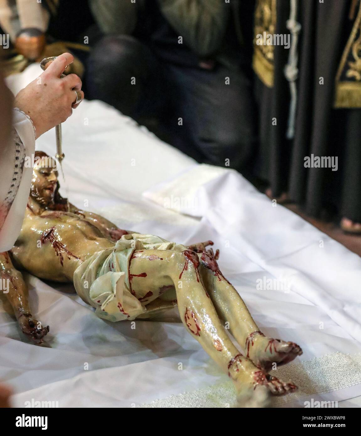 Jerusalem, Israel. 29th Mars 2024.  The Catholic service denoting the burial of Jesus, on the Stone of Atonement at the Church of the Holy Sepulchre.  Credit: Yoram Biberman/Alamy Live News. Stock Photo