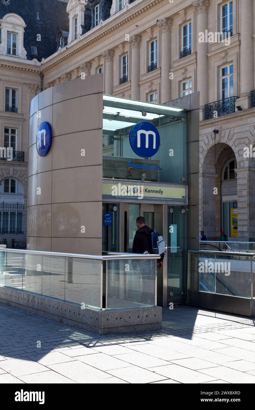 Rennes, France - July 30 2017: Commuter entering the subway station of République outside of the Palais du Commerce in the center of Rennes. Stock Photo