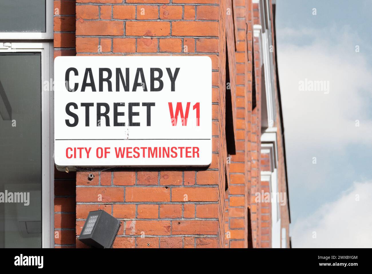 A street sign for Carnaby Street, a symbol of British culture and fashion. Symbolic of the swinging sixties and still a shopping and tourist favourite Stock Photo