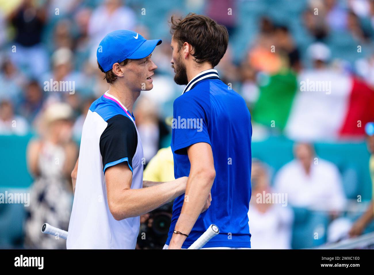 MIAMI GARDENS, FLORIDA - MARCH 29: Jannik Sinner of Italy meets Daniil Medvedev at the net after defeating him during their match on Day 14 of the Miami Open at Hard Rock Stadium on March 29, 2024 in Miami Gardens, Florida. (Photo by Mauricio Paiz) Stock Photo