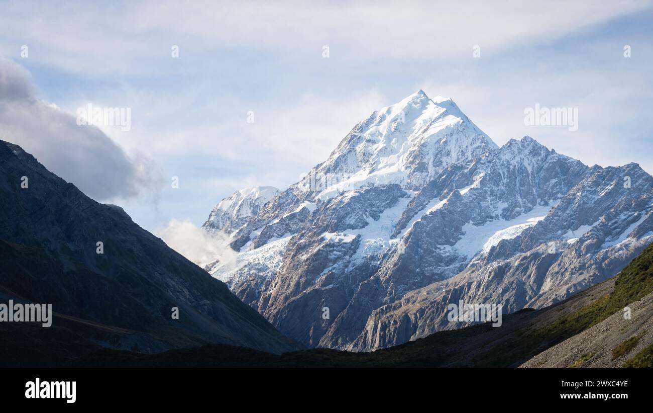 Detailed view on massive snowy mountain with glaciers from valley down below, Mt Cook, New Zealand. Stock Photo