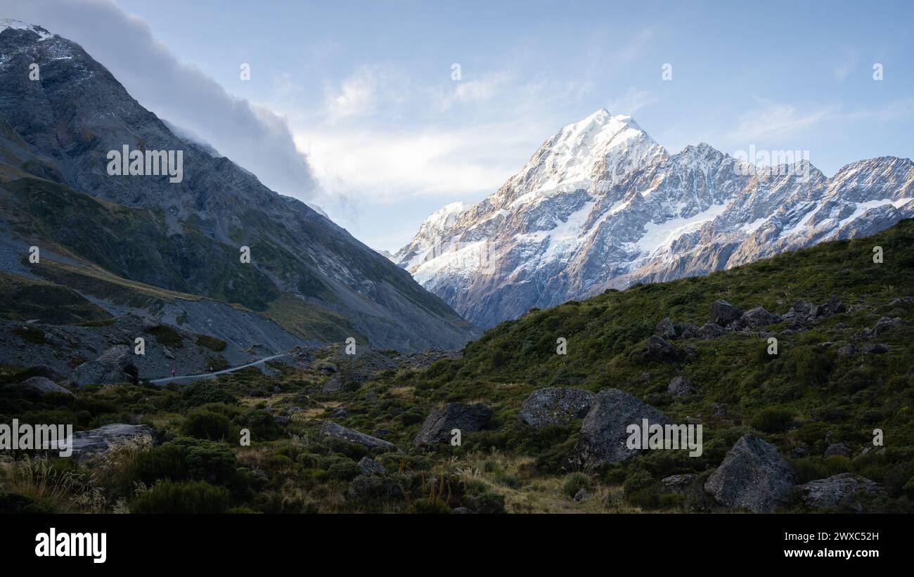 Dominant snowy mountain with glaciers catching last light of the day, Mt Cook, New Zealand. Stock Photo
