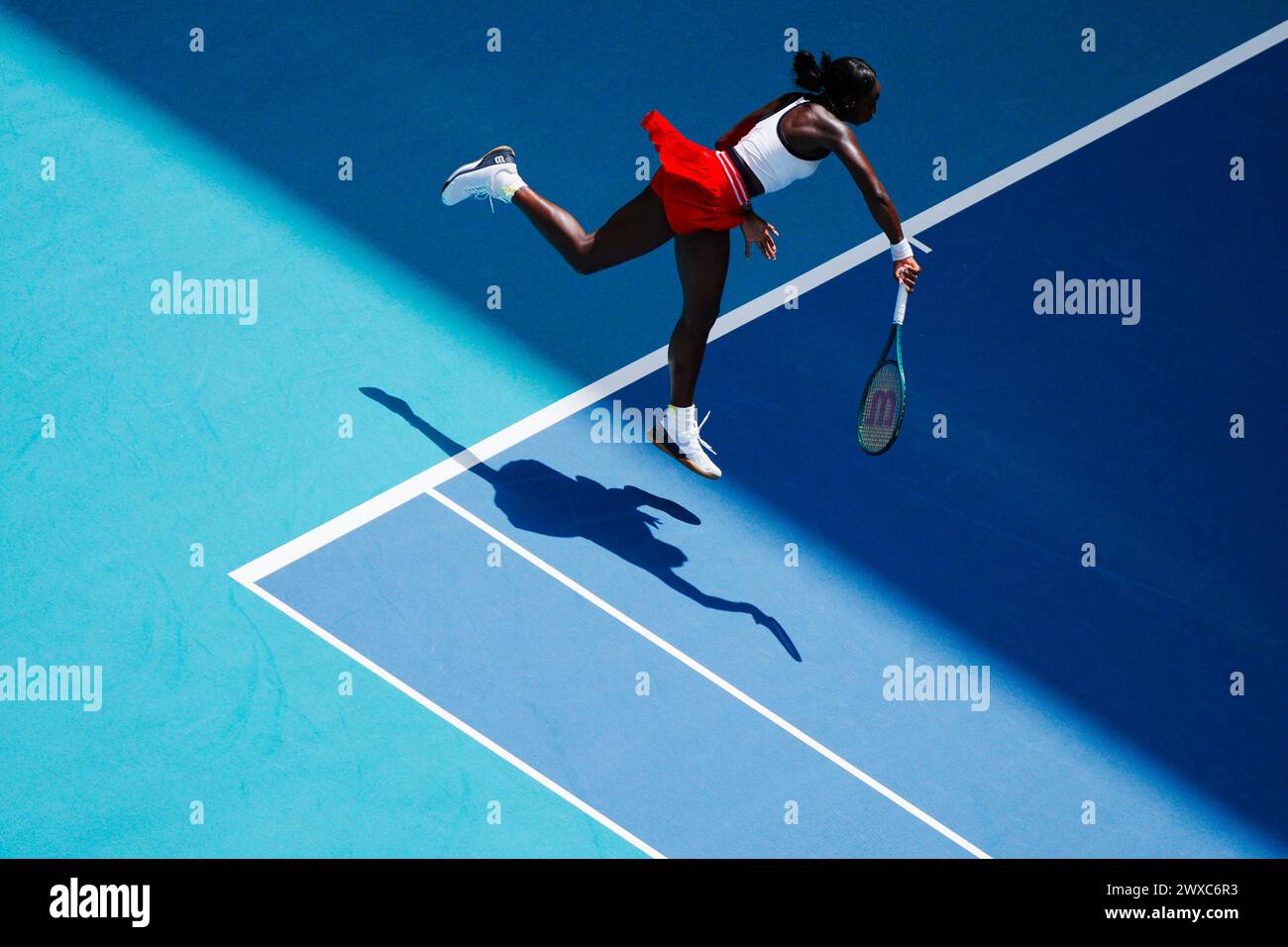 Miami, Florida, USA. 29th Mar, 2024. Alycia Parks (USA) hits a serve