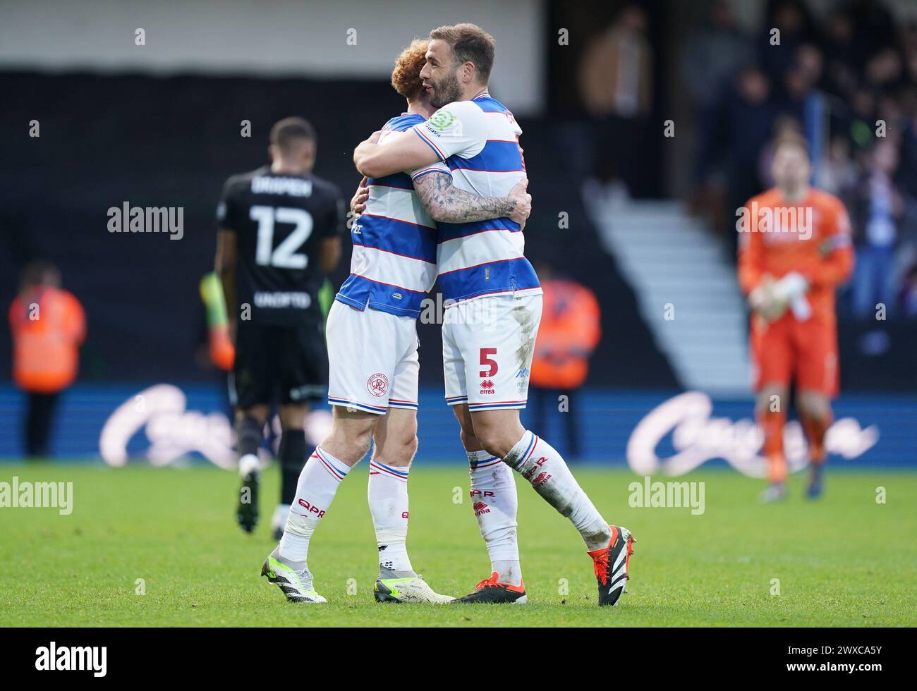 LONDON, ENGLAND - MARCH 29: Jack Colback of Queens Park Rangers and Steve Cook of Queens Park Rangers celebrating after the Sky Bet Championship match between Queens Park Rangers and Birmingham City at Loftus Road on March 29, 2024 in London, England.(Photo by Dylan Hepworth/MB Media) Stock Photo