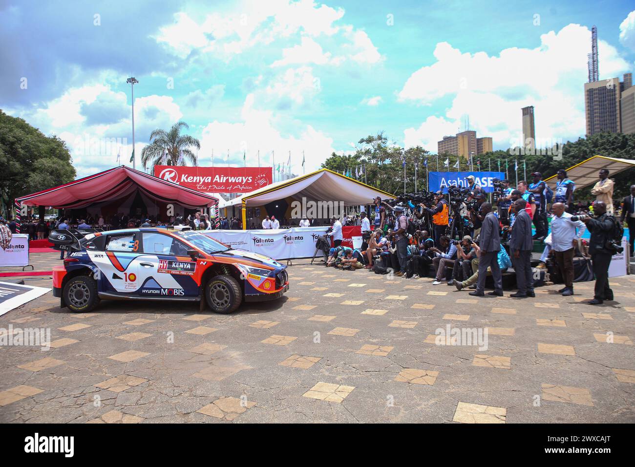 Local and international Photographers and Videographers document the official flagging off ceremony of the 2024 World Rally Championship (WRC) Safari Rally at the Kenyatta International Convention Center. His Excellency the President of Kenya, William Ruto, officially launched the 2024 WRC Safari Rally competition at the Kenyatta International Conventional Centre (KICC) in Nairobi. This is the 71st edition of the Safari Rally in Kenya, Nairobi the capital city. The event marks the third round of this year's FIA (Fédération Internationale de l'Automobile) World Rally Championship. President Rut Stock Photo