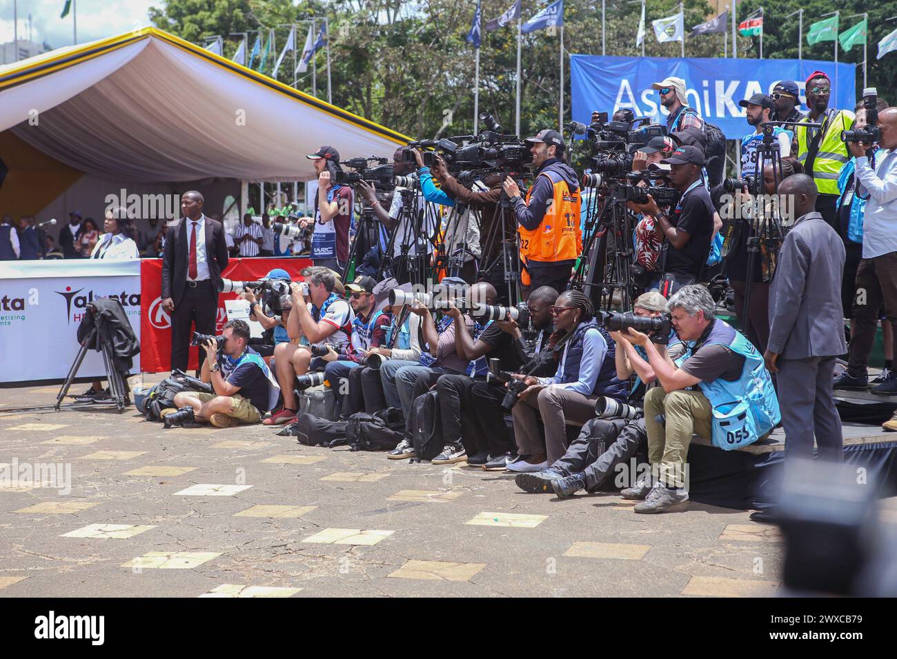 Local and international Photographers and Videographers document the official flagging off ceremony of the 2024 World Rally Championship (WRC) Safari Rally at the Kenyatta International Convention Center. His Excellency the President of Kenya, William Ruto, officially launched the 2024 WRC Safari Rally competition at the Kenyatta International Conventional Centre (KICC) in Nairobi. This is the 71st edition of the Safari Rally in Kenya, Nairobi the capital city. The event marks the third round of this year's FIA (Fédération Internationale de l'Automobile) World Rally Championship. President Rut Stock Photo