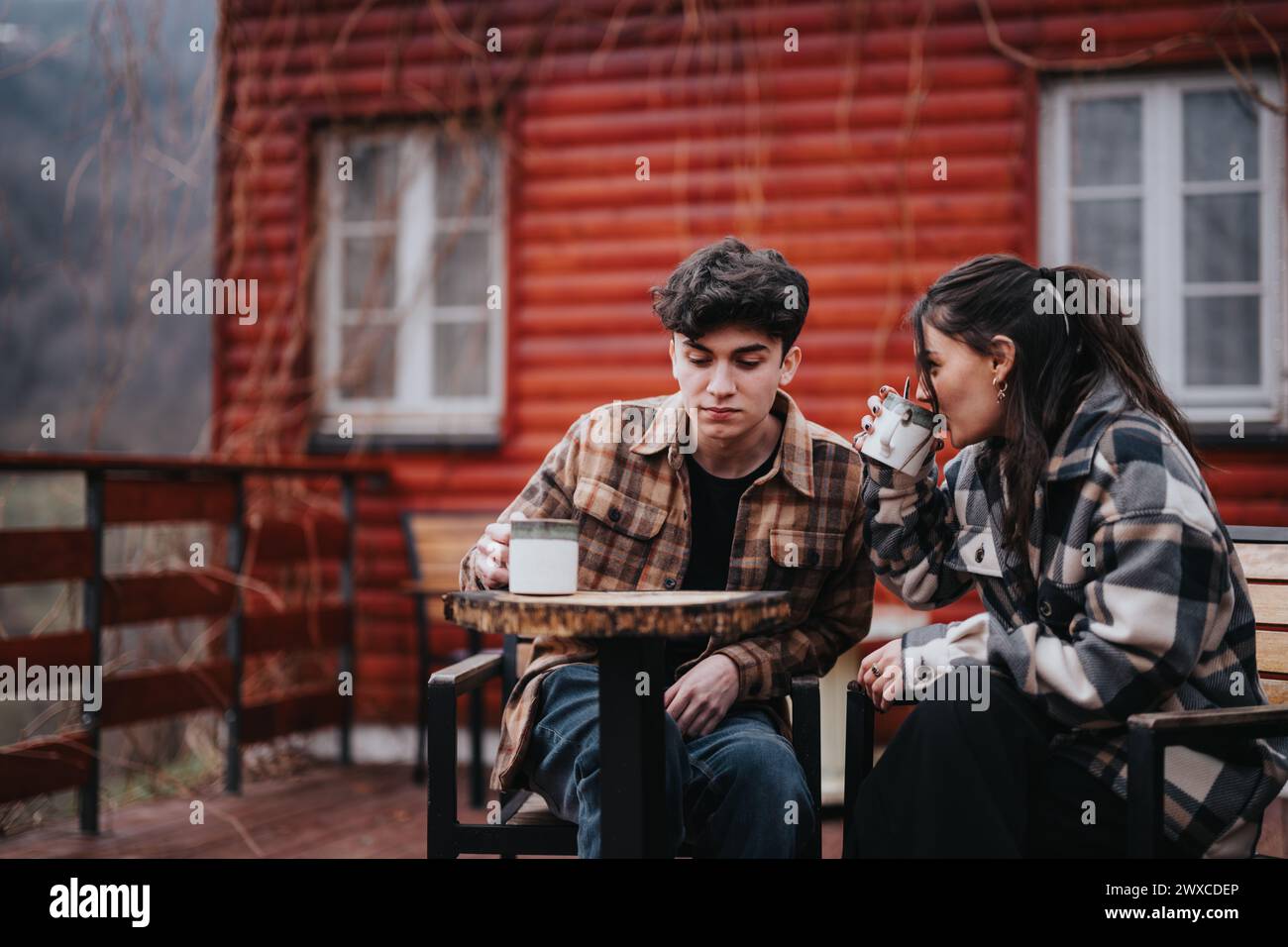 Couple sitting on cabin porch hi-res stock photography and images - Alamy