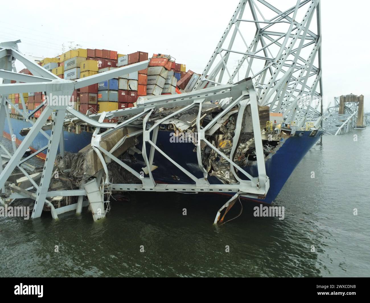 The Motor Vessel Dali is shown with the collapsed Francis Scott Key Bridge on March 28, 2024, in Baltimore. The Key Bridge Response Unified Command priorities are ensuring the safety of the public and first responders, accountability of missing persons, safely restoring transportation infrastructure and commerce, protecting the environment, and supporting the investigation. (U.S. Coast Guard photo) Stock Photo