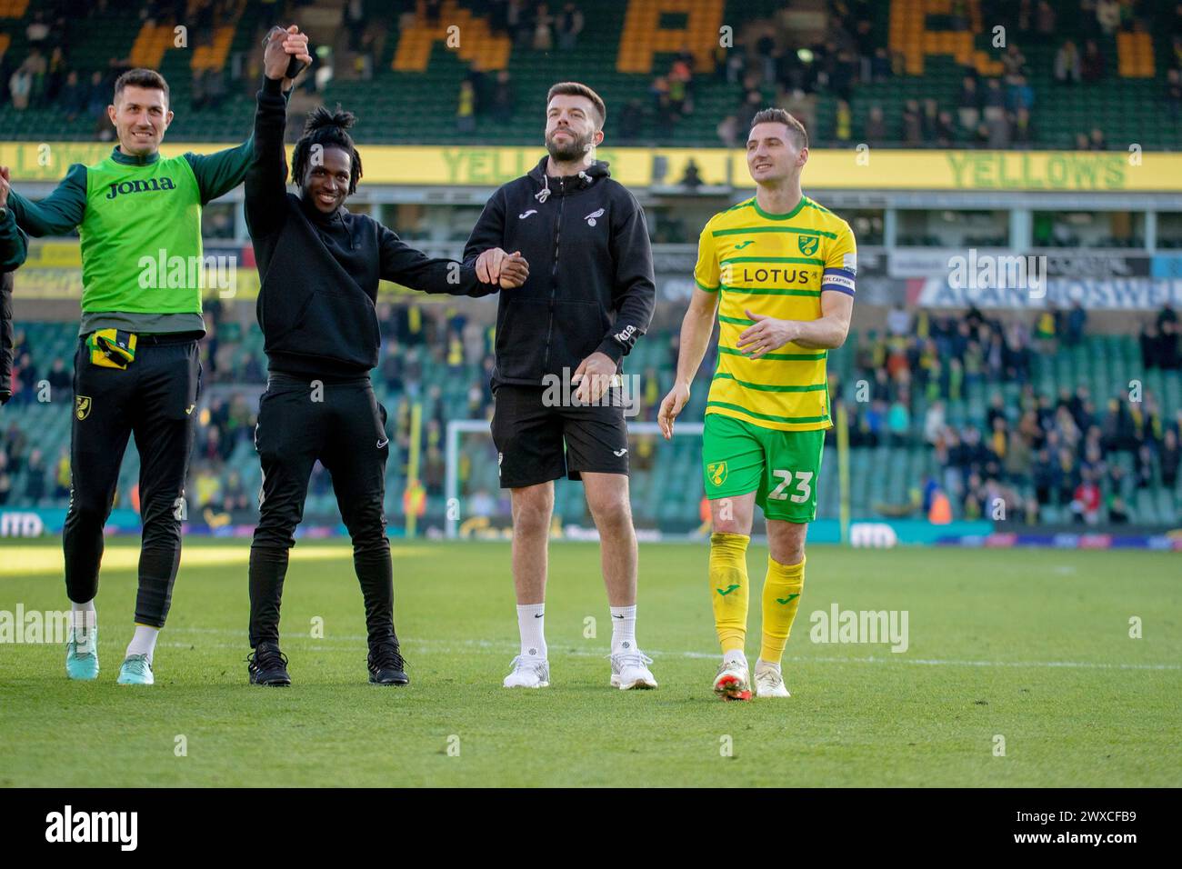 Kenny McLean of Norwich City, Grant Hanley of Norwich City and Jonathan Rowe of Norwich City celebrating during the Sky Bet Championship match between Norwich City and Plymouth Argyle at Carrow Road, Norwich on Friday 29th March 2024. (Photo: David Watts | MI News) Credit: MI News & Sport /Alamy Live News Stock Photo