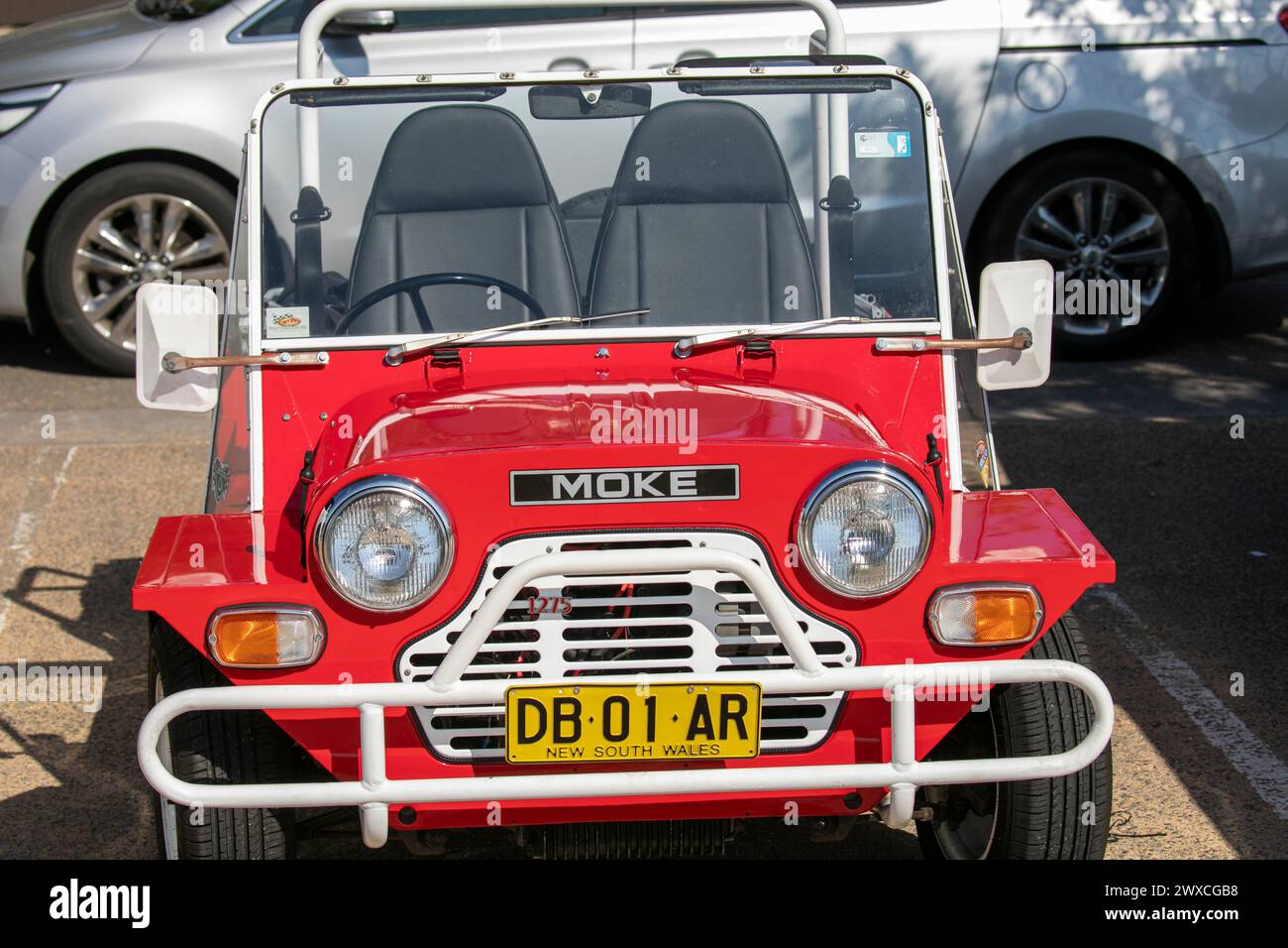 1980 Austin Leyland Mini Moke Californian utility vehicle in red, parked at Palm Beach in Sydney,Australia,2024, Australia did manufacture the Moke Stock Photo