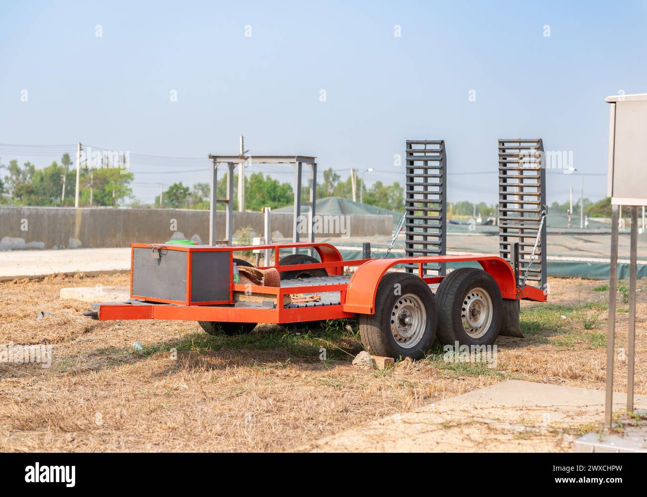 Trailer flatbed platform for transporting machinery in factory. Stock Photo