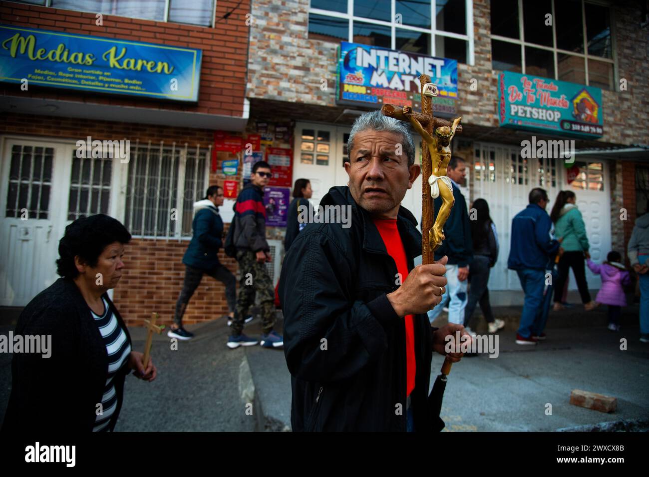 Bogota, Colombia. 29th Mar, 2024. People take part during the Good Friday procession in Ciudad Bolivar locality as part of the Holy Week celebrations in Bogota, Colombia, March 29, 2024. Photo by: Chepa Beltran/Long Visual Press Credit: Long Visual Press/Alamy Live News Stock Photo