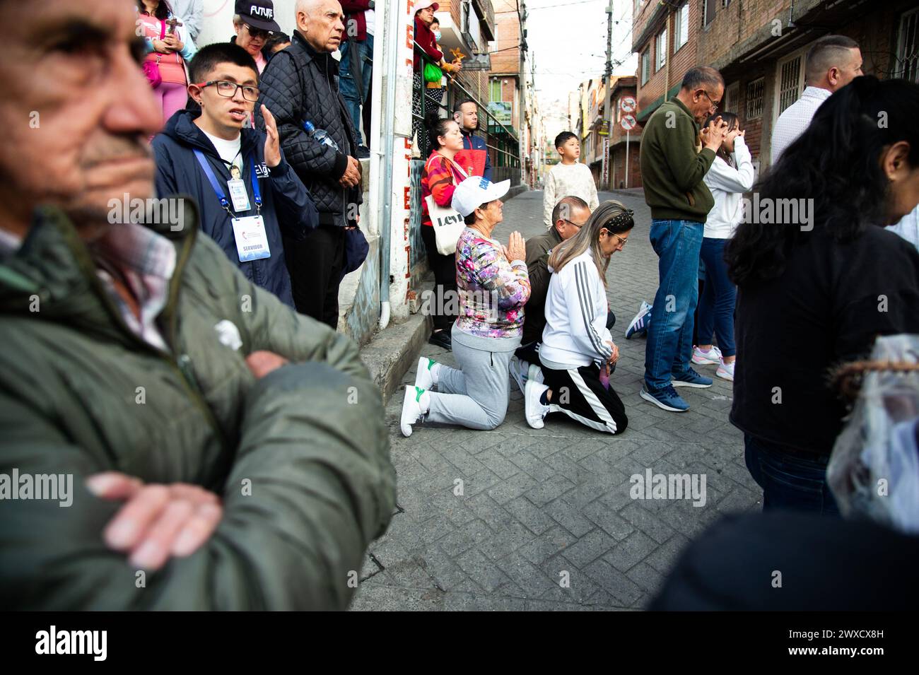 Bogota, Colombia. 29th Mar, 2024. People take part during the Good Friday procession in Ciudad Bolivar locality as part of the Holy Week celebrations in Bogota, Colombia, March 29, 2024. Photo by: Chepa Beltran/Long Visual Press Credit: Long Visual Press/Alamy Live News Stock Photo