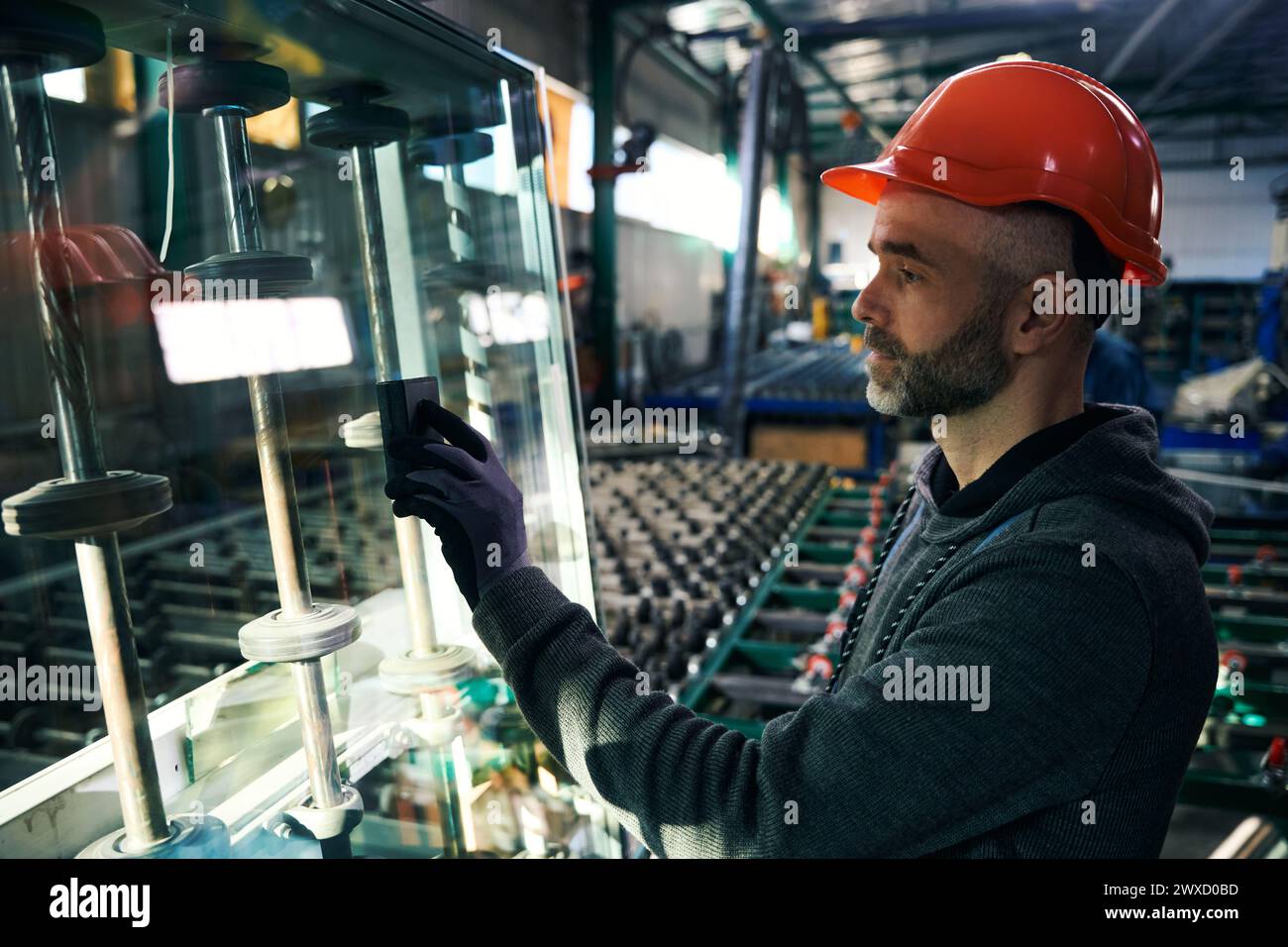 Employee uses special tools for working with glass Stock Photo