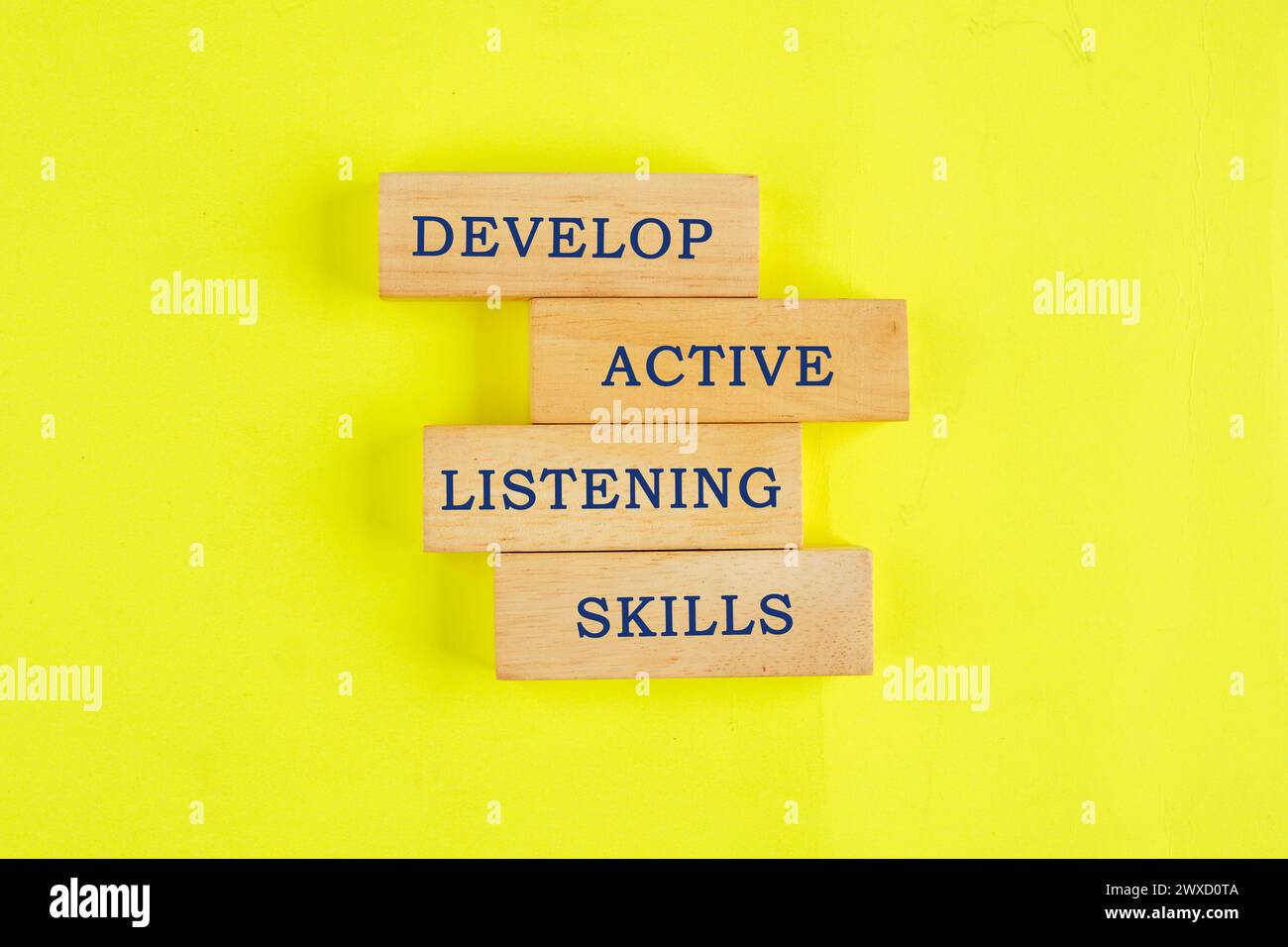 Concept word Develop active listening skills on wooden blocks on a ...