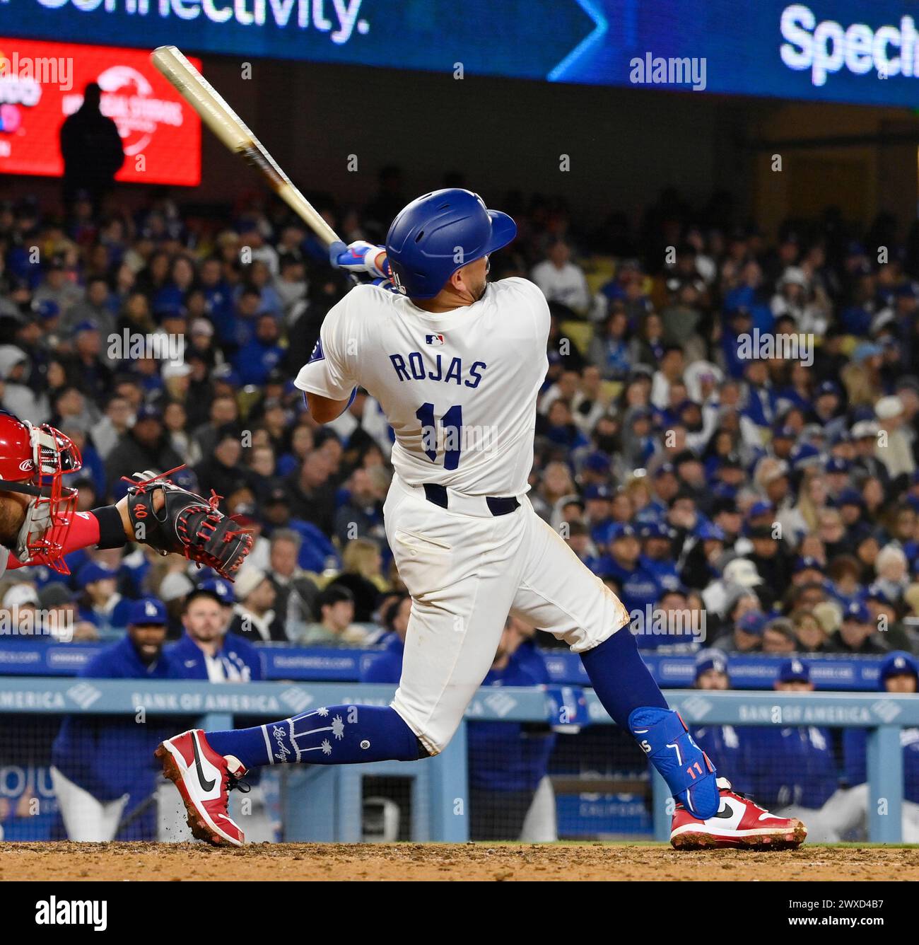 Los Angeles, United States. 29th Mar, 2025. Los Angeles Dodgers shortstop Miguel Rojas hits a