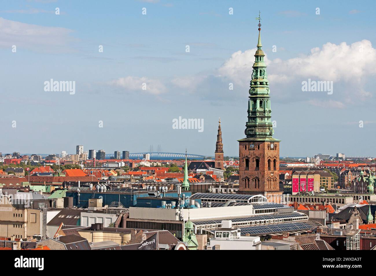 Copenhagen city view with bell tower of St. Nikolaj Church (now  Nikolaj Contemporary Art Gallery) in the foreground, Copenhagen, Denmark Stock Photo