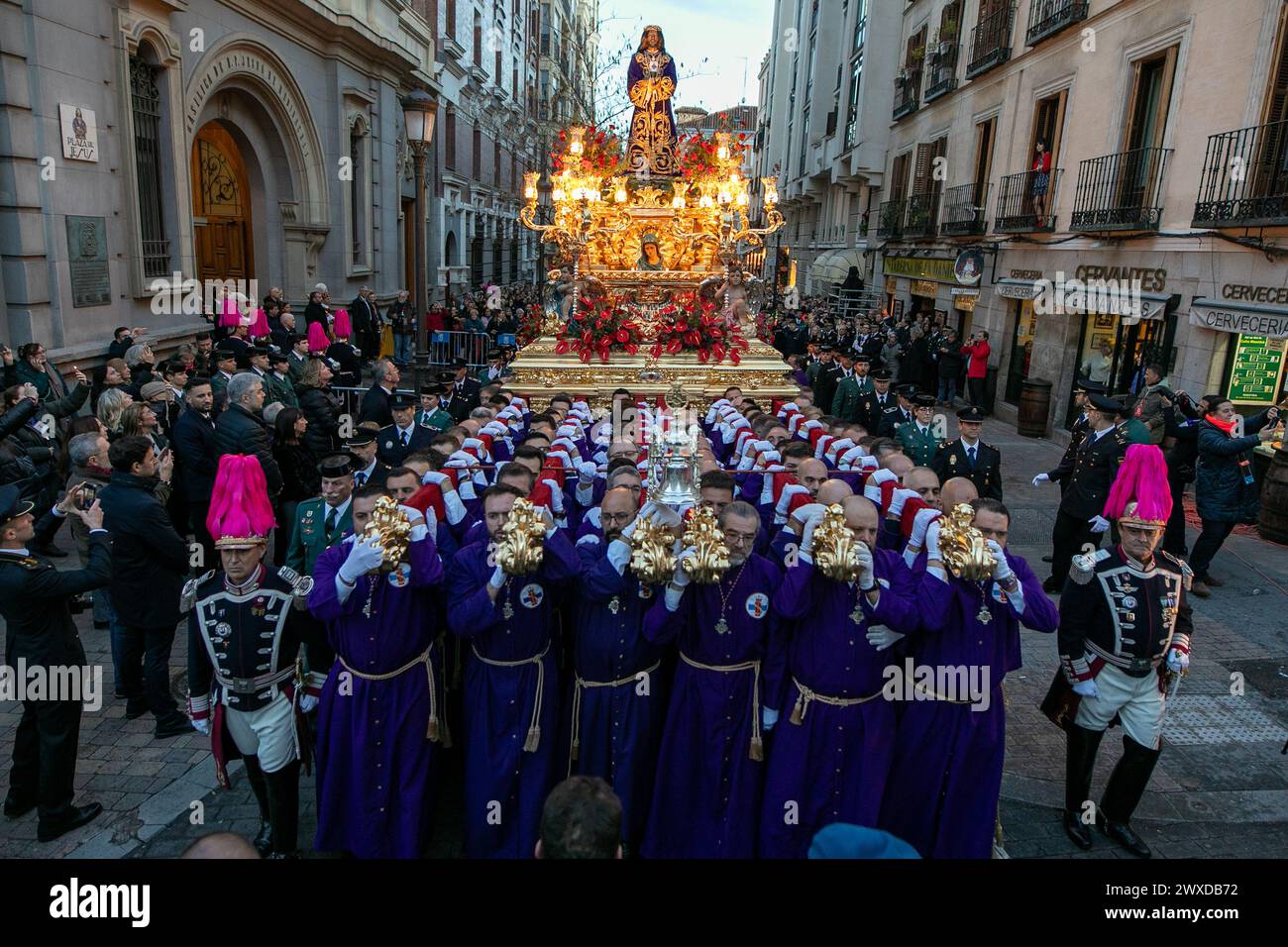 Madrid, Spain. 29th Mar, 2024. The Lord of Madrid (Cristo de Medinaceli) is taken out in procession by the bearers of the Basilica of Jesús de Medinaceli on Good Friday. This Good Friday, the brotherhood of the Primary Archconfraternity of the Real and Illustrious Slavery of Nuestro Padre Jesús Nazareno de Medinaceli, popularly known as 'The Lord of Madrid, has processed like every Good Friday through the streets of the center of Madrid. Credit: SOPA Images Limited/Alamy Live News Stock Photo