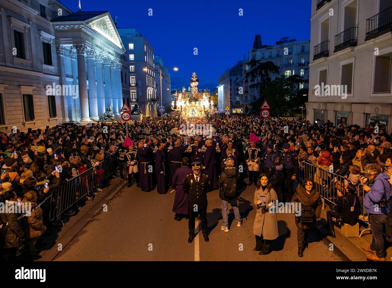 Madrid, Spain. 29th Mar, 2024. The Lord of Madrid (Cristo de Medinaceli) is carried in procession by the bearers of the Medinaceli brotherhood in front of the Congress of Deputies on Good Friday. This Good Friday, the brotherhood of the Primary Archconfraternity of the Real and Illustrious Slavery of Nuestro Padre Jesús Nazareno de Medinaceli, popularly known as 'The Lord of Madrid, has processed like every Good Friday through the streets of the center of Madrid. Credit: SOPA Images Limited/Alamy Live News Stock Photo