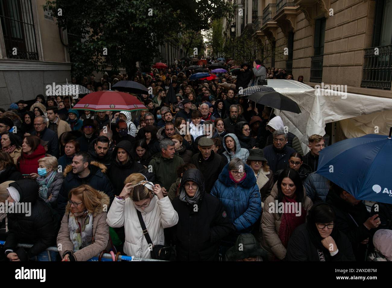 Madrid, Spain. 29th Mar, 2024. A group of Christians of the 'Lord of Madrid' (Cristo de Medinaceli) wait for the Good Friday procession. This Good Friday, the brotherhood of the Primary Archconfraternity of the Real and Illustrious Slavery of Nuestro Padre Jesús Nazareno de Medinaceli, popularly known as 'The Lord of Madrid, has processed like every Good Friday through the streets of the center of Madrid. Credit: SOPA Images Limited/Alamy Live News Stock Photo