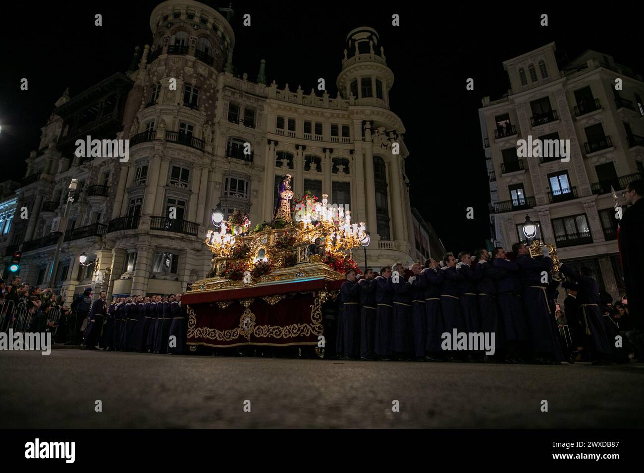 Madrid, Spain. 29th Mar, 2024. The Lord of Madrid (Cristo de Medinaceli) is carried in procession by the costaleros of the Medinaceli brotherhood through the center of Madrid on Good Friday. This Good Friday, the brotherhood of the Primary Archconfraternity of the Real and Illustrious Slavery of Nuestro Padre Jesús Nazareno de Medinaceli, popularly known as 'The Lord of Madrid, has processed like every Good Friday through the streets of the center of Madrid. Credit: SOPA Images Limited/Alamy Live News Stock Photo