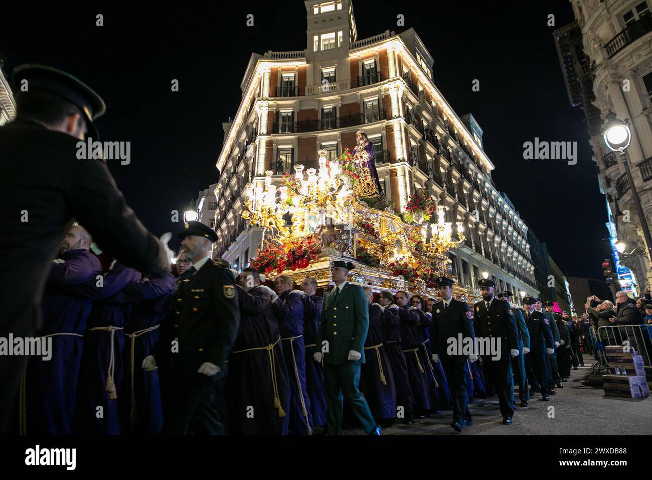 Madrid, Spain. 29th Mar, 2024. The Lord of Madrid (Cristo de Medinaceli) is carried in procession by the costaleros of the Medinaceli brotherhood through the center of Madrid on Good Friday. This Good Friday, the brotherhood of the Primary Archconfraternity of the Real and Illustrious Slavery of Nuestro Padre Jesús Nazareno de Medinaceli, popularly known as 'The Lord of Madrid, has processed like every Good Friday through the streets of the center of Madrid. Credit: SOPA Images Limited/Alamy Live News Stock Photo