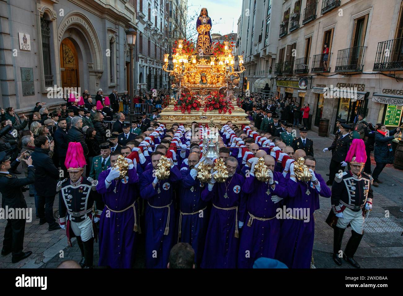 Madrid, Spain. 29th Mar, 2024. The Lord of Madrid (Cristo de Medinaceli) is taken out in procession by the bearers of the Basilica of Jesús de Medinaceli on Good Friday. This Good Friday, the brotherhood of the Primary Archconfraternity of the Real and Illustrious Slavery of Nuestro Padre Jesús Nazareno de Medinaceli, popularly known as 'The Lord of Madrid, has processed like every Good Friday through the streets of the center of Madrid. (Photo by David Canales/SOPA Images/Sipa USA) Credit: Sipa USA/Alamy Live News Stock Photo