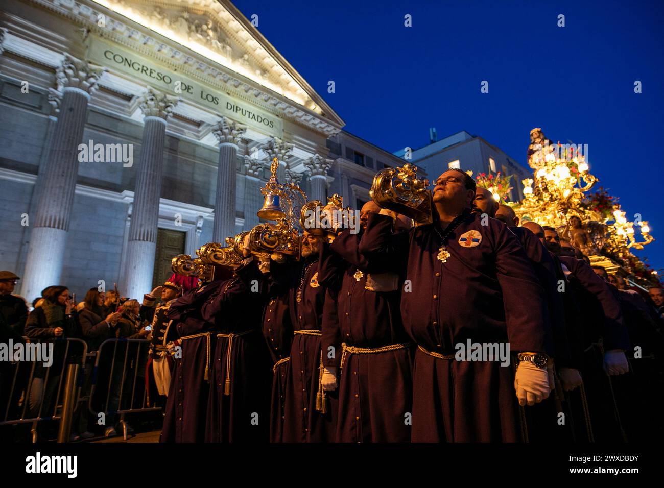 Madrid, Spain. 29th Mar, 2024. The Lord of Madrid (Cristo de Medinaceli) is carried in procession by the bearers of the Medinaceli brotherhood in front of the Congress of Deputies on Good Friday. This Good Friday, the brotherhood of the Primary Archconfraternity of the Real and Illustrious Slavery of Nuestro Padre Jesús Nazareno de Medinaceli, popularly known as 'The Lord of Madrid, has processed like every Good Friday through the streets of the center of Madrid. (Photo by David Canales/SOPA Images/Sipa USA) Credit: Sipa USA/Alamy Live News Stock Photo