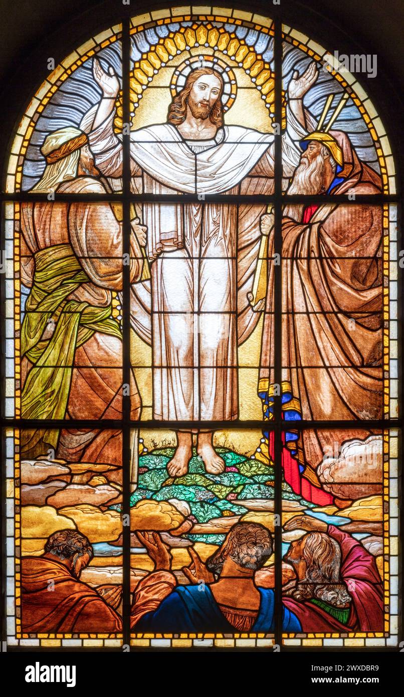 MILAN, ITALY - MARCH 6, 2024: The Transfiguration in the stained glass of the church Chiesa del Redentore by author with the initials G.R. (1933). Stock Photo