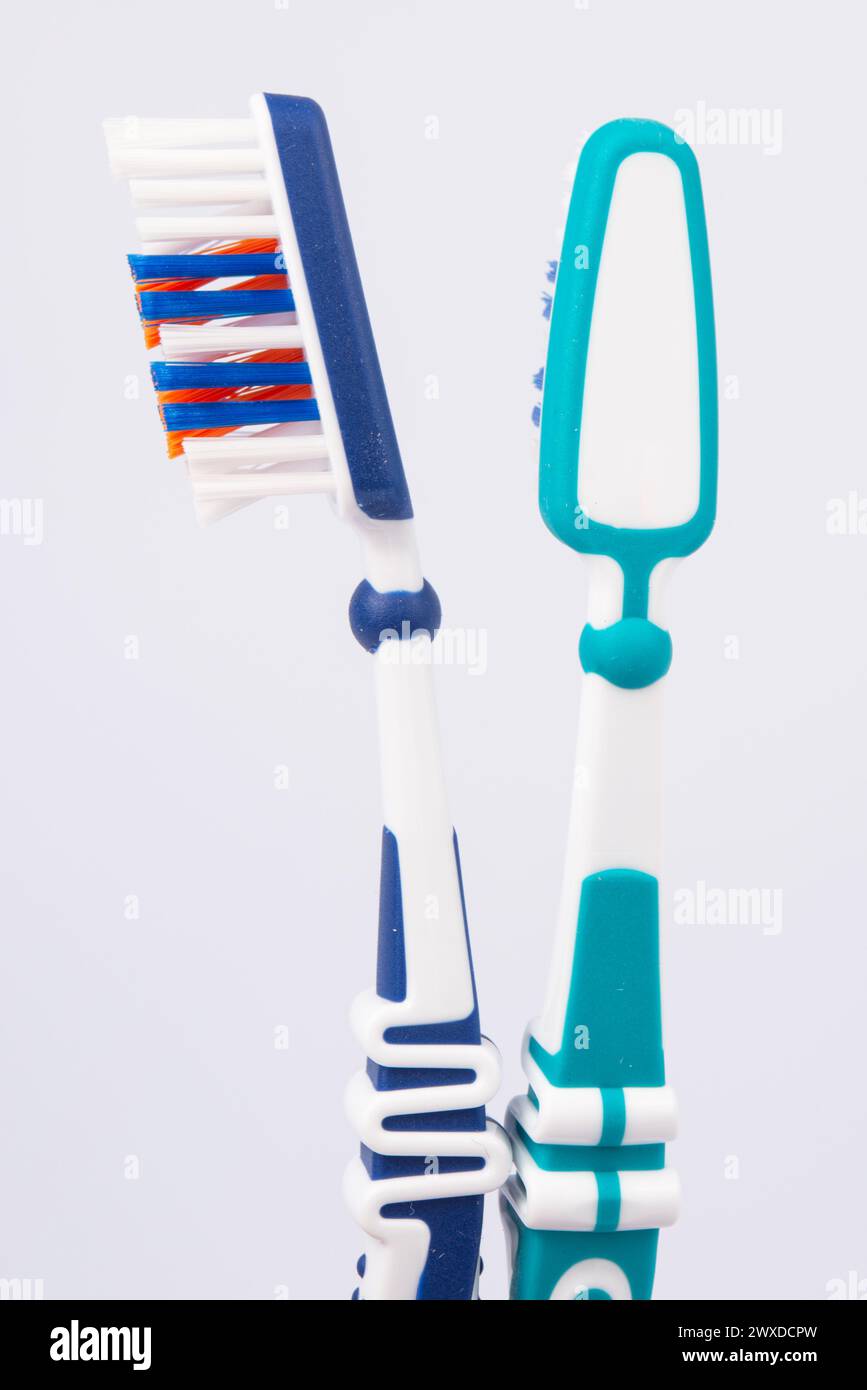Colored toothbrushes. Isolated on white background. Stock Photo