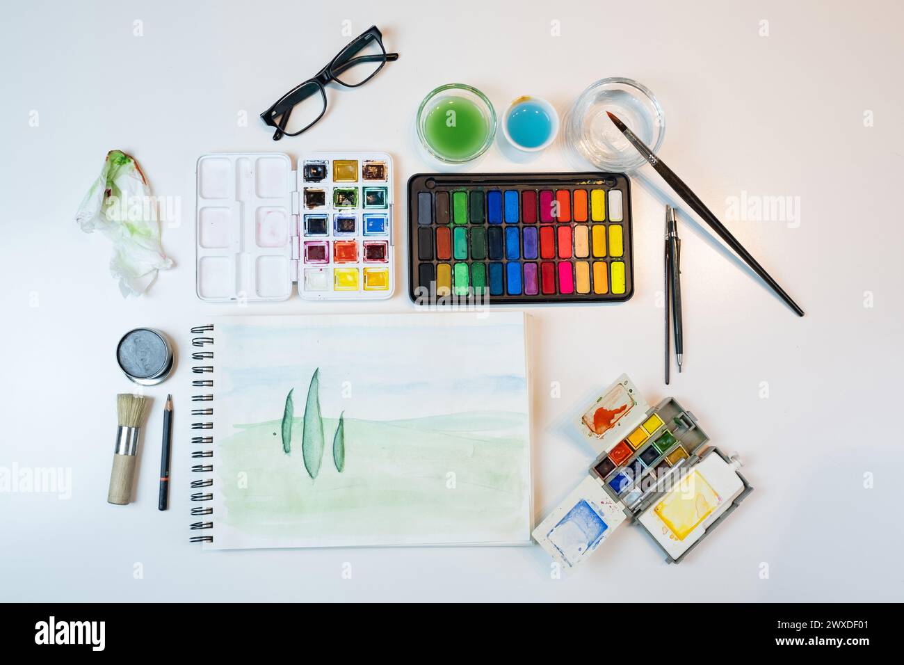 Landscape of Watercolor materials perfectly arranged on a white table ...