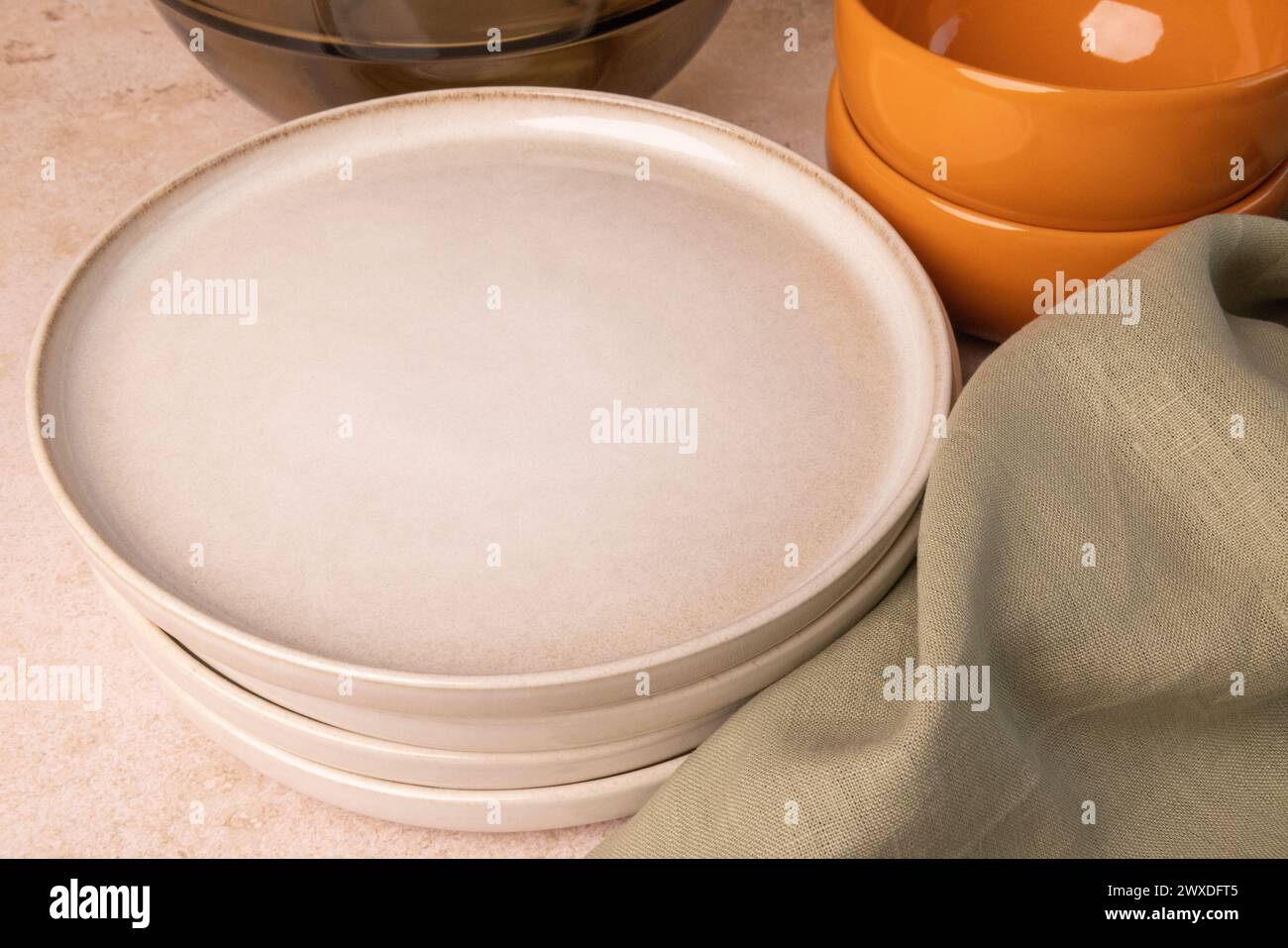 A selection of tableware on a brown stone tabletop. Stock Photo