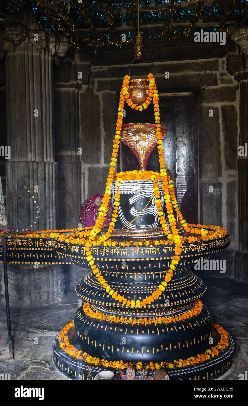 hindu religious god shiva Shivalinga decorated with flowers from different angle at ancient temple image is taken at Kumbhal fort kumbhalgarh rajastha Stock Photo