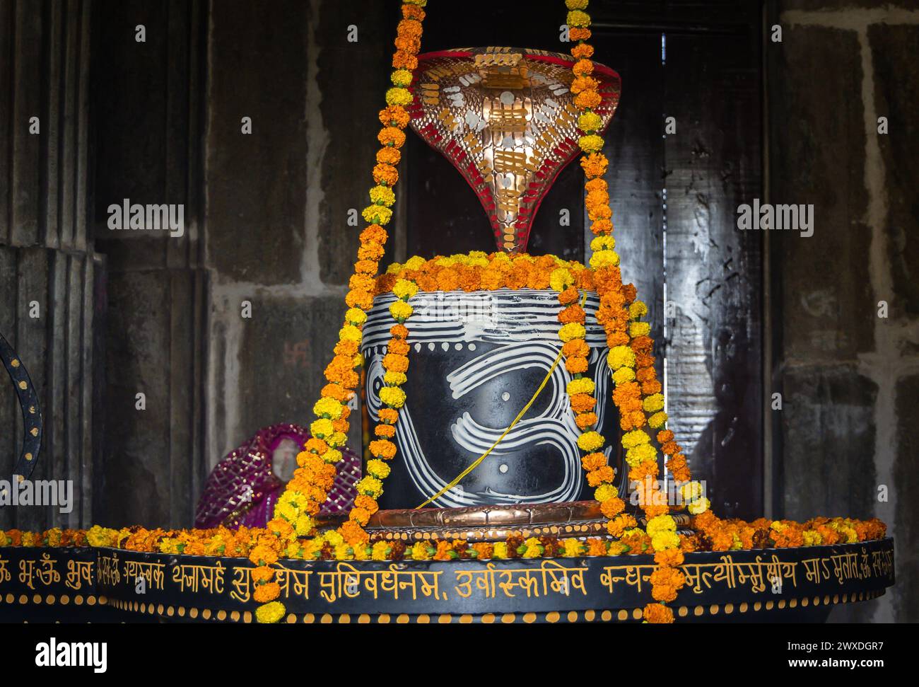 hindu religious god shiva Shivalinga decorated with flowers from different angle at ancient temple image is taken at Kumbhal fort kumbhalgarh rajastha Stock Photo
