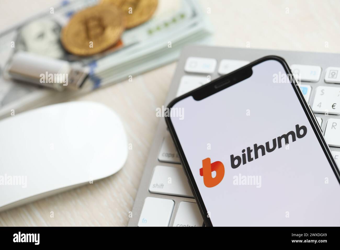 KYIV, UKRAINE - MARCH 15, 2024 Bithumb logo on iPhone display screen on ...