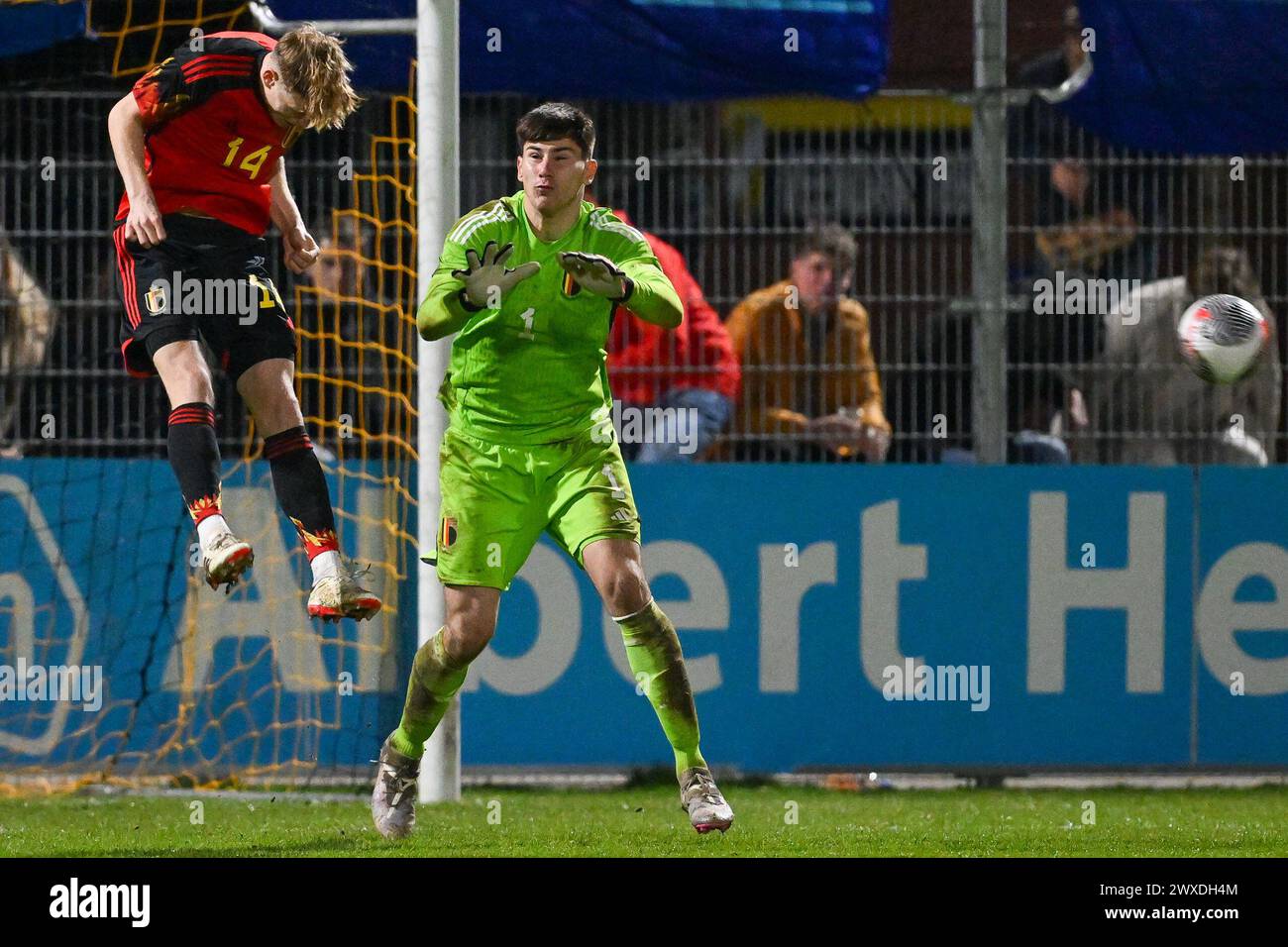 Veendam, The Netherlands. 26th Mar, 2024. Arthur Piedfort (14) of Belgium and goalkeeper Mike Penders (1) of Belgium pictured in action during a soccer game between the national under 19 teams of Belgium and The Netherlands on matchday 3 in group 2 of the UEFA Under-19 Elite round on Thursday 26 March 2024 in Veendam, The Netherlands . Credit: sportpix/Alamy Live News Stock Photo