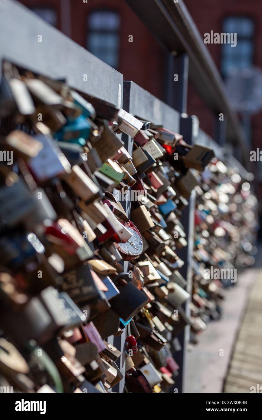 Love lock bridge at Katajanokka with many locks. Couples putting locks on bridges. Bridge full of locks. Vertical photos. Stock Photo