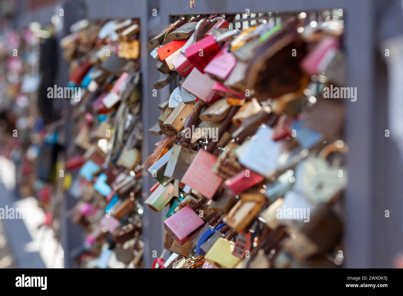 Love lock bridge at Katajanokka with many locks. Couples putting locks on bridges. Bridge full of locks. Vertical photos. Stock Photo