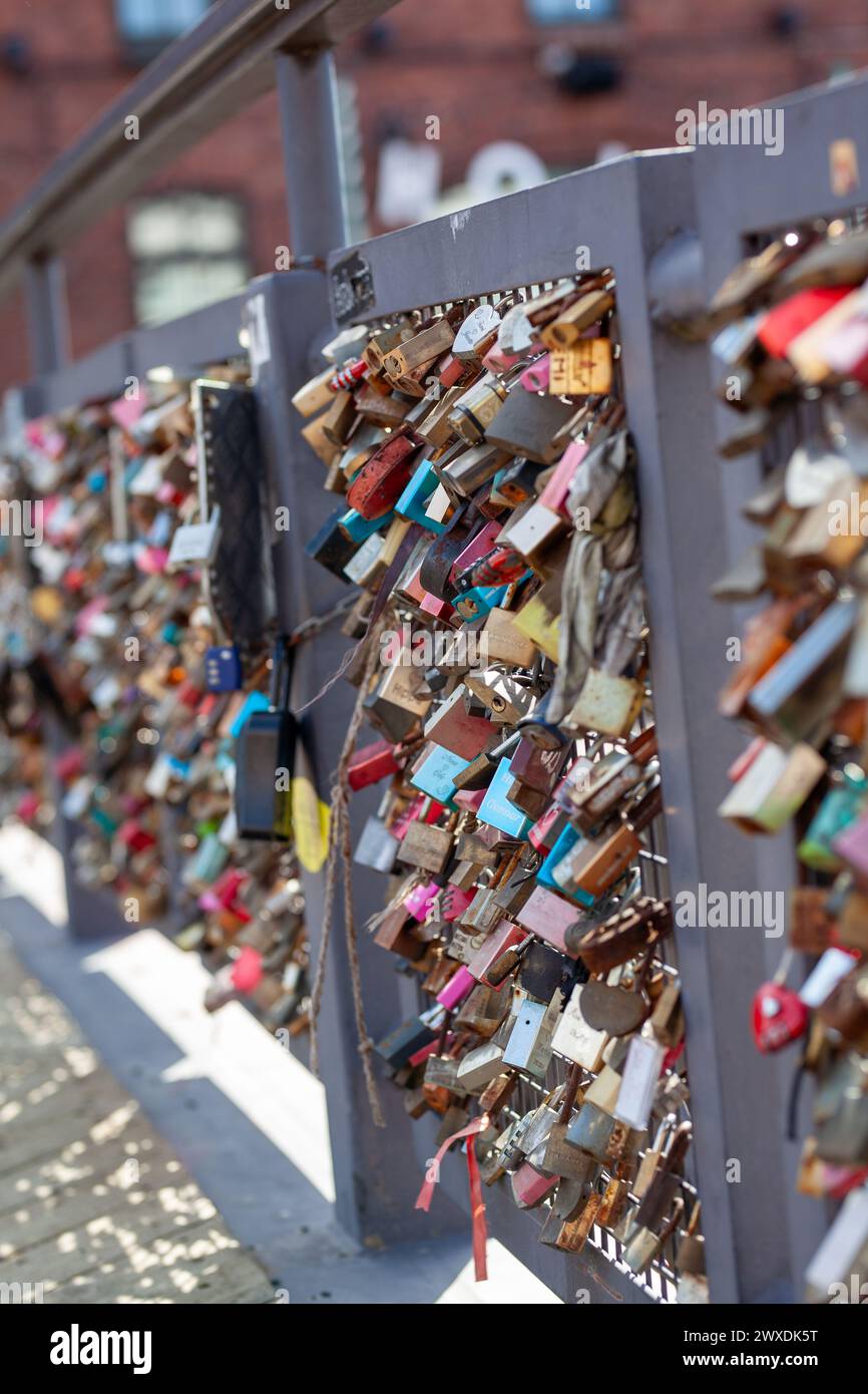 Love lock bridge at Katajanokka with many locks. Couples putting locks