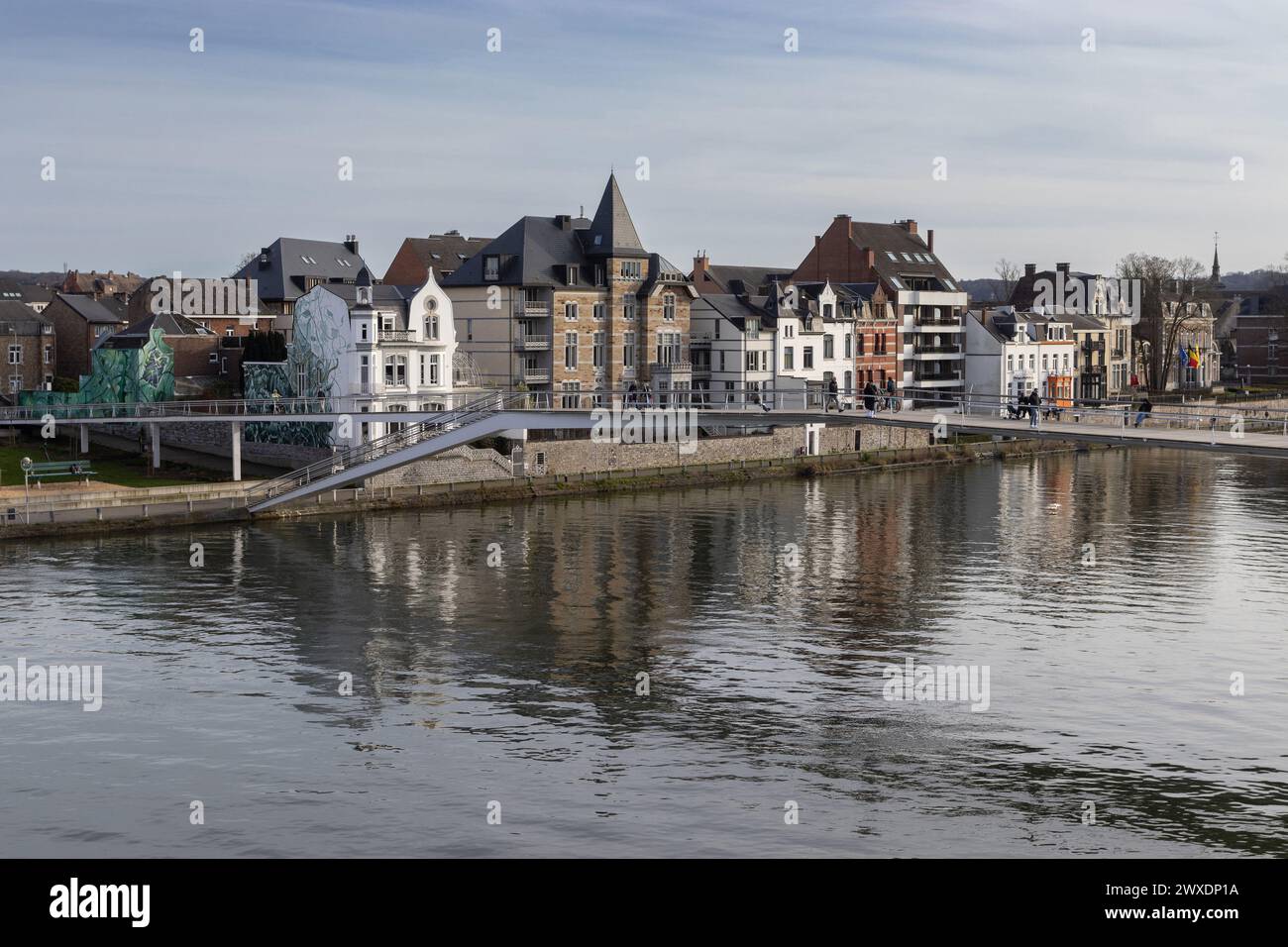 NAMUR, BELGIUM, 25 MARCH 2024: View of the new footbridge: Passerelle l'Enjambée across the Meuse river in Namur. Completed in 2020 it connects the Gr Stock Photo