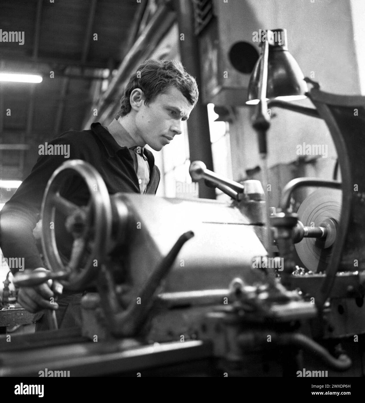 Socialist Republic of Romania in the 1970s. Portrait of a turner working in a state-owned factory. Stock Photo