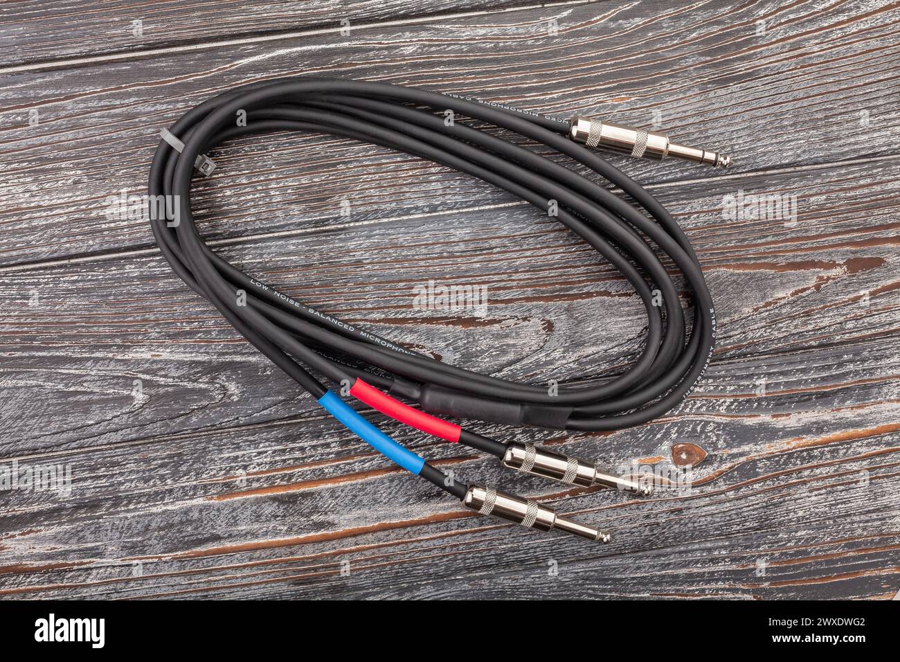 audio insert splitter cable on wood background Stock Photo