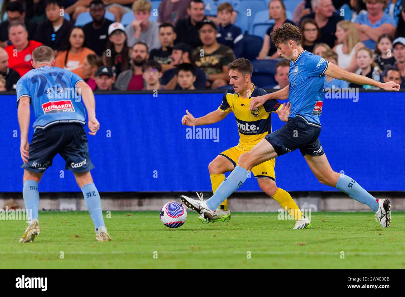 Sydney, Australia. 30th Mar, 2024. Hayden Matthews of Sydney FC competes for the ball with Joshua Nisbet of the Mariners during the A-League Men Rd22 match between Sydney FC and the Mariners at Allianz Stadium on March 30, 2024 in Sydney, Australia Credit: IOIO IMAGES/Alamy Live News Stock Photo