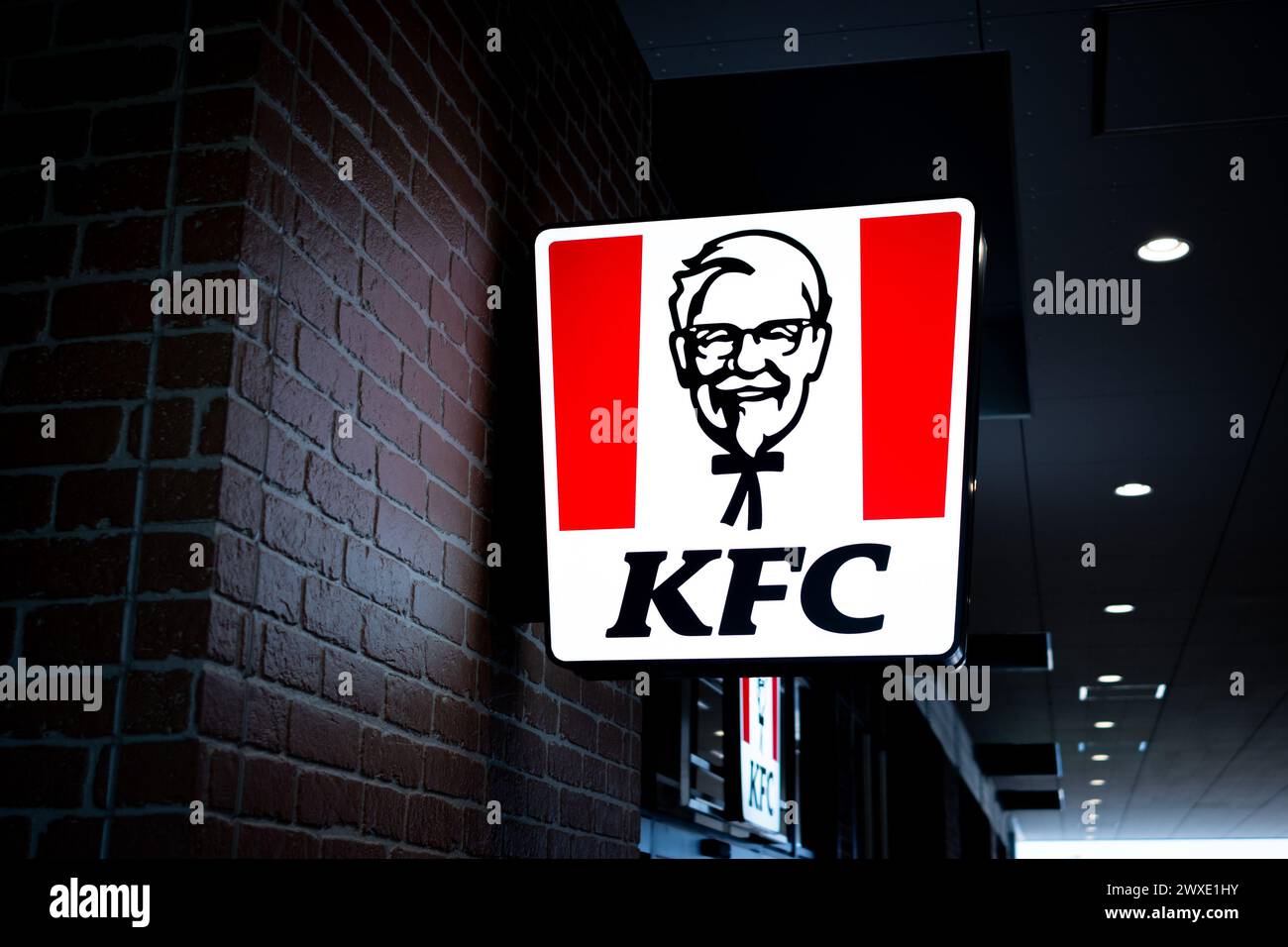 KFC sign and logo on a building wall - close up shot Stock Photo