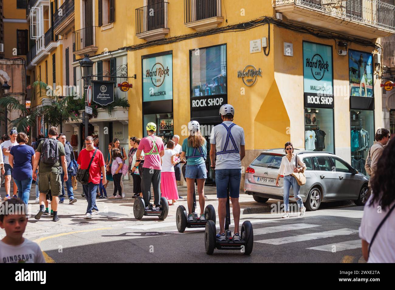 Palma de Mallorca, Spain - April 29, 2023: Tourists are using segway to transport around the streets and explore the city of Palma de Mallorca Stock Photo