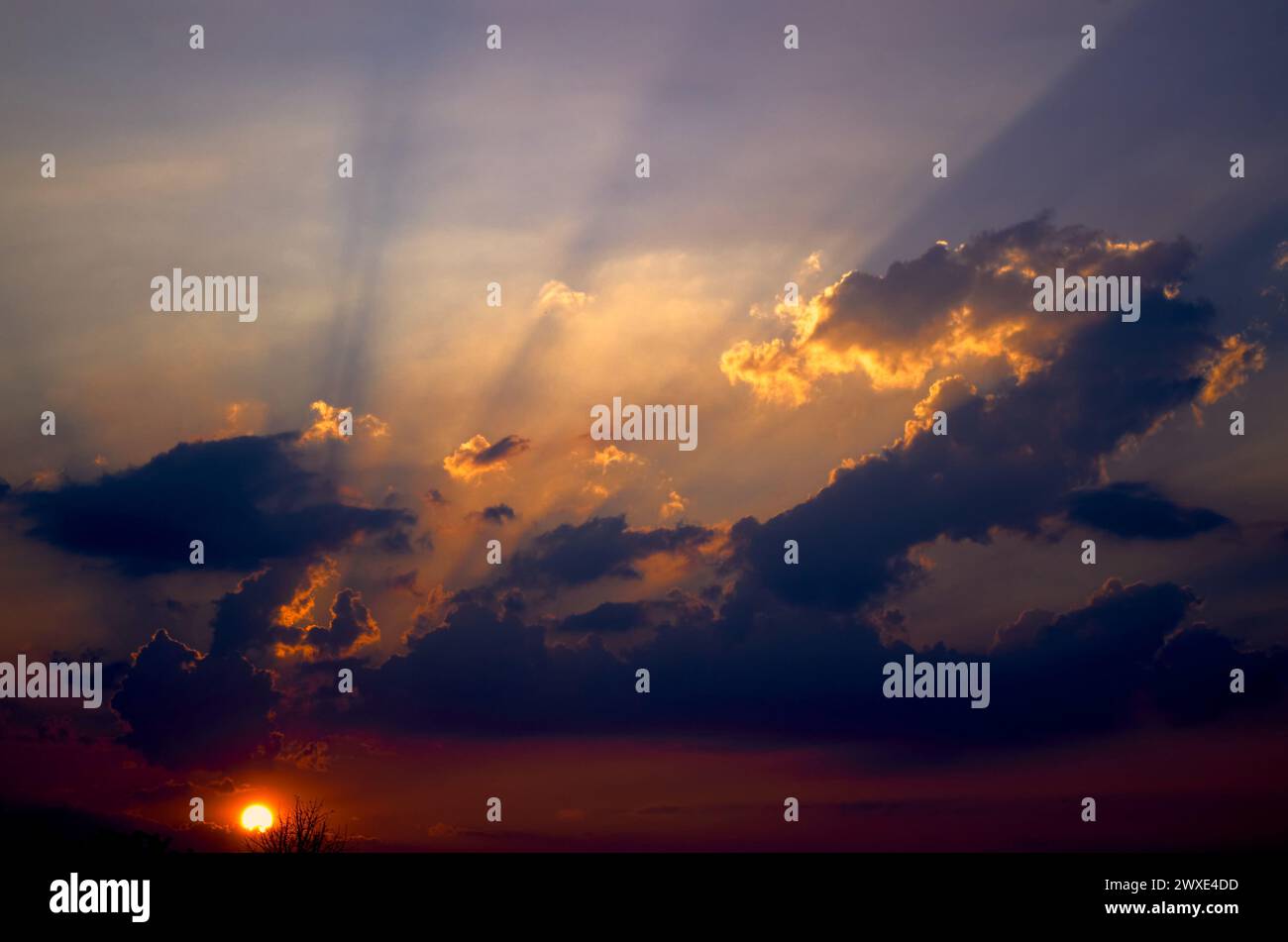 The sun rays through the cloud Stock Photo - Alamy