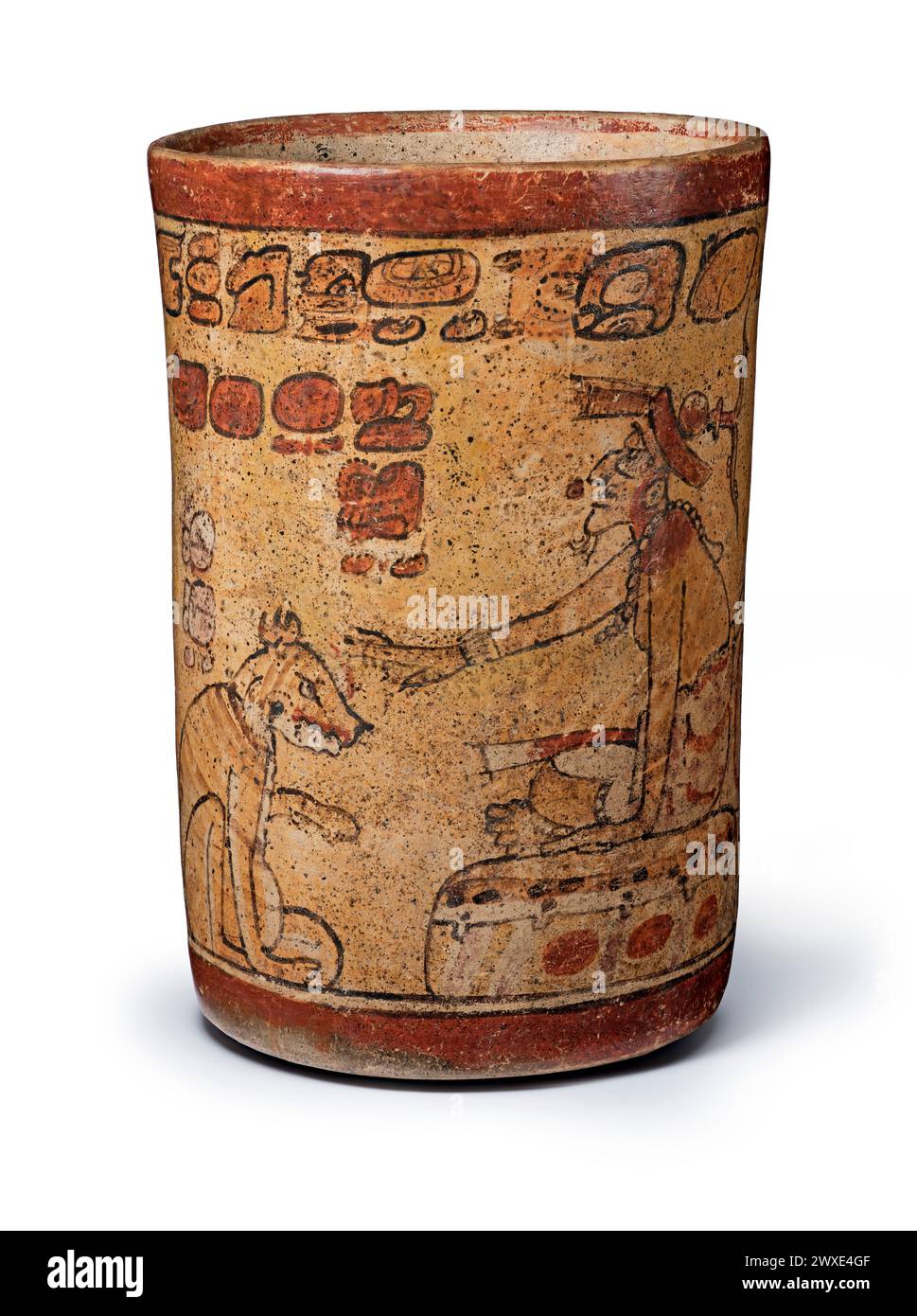 Classic period Maya slip-painted ceramic polychrome cylinder vessel from Guatemala or Mexico depicting Vessel with Itzamnaaj, Dog, and Hero Twins. Maya, 600-900 CE. 16.5cm high. Stock Photo