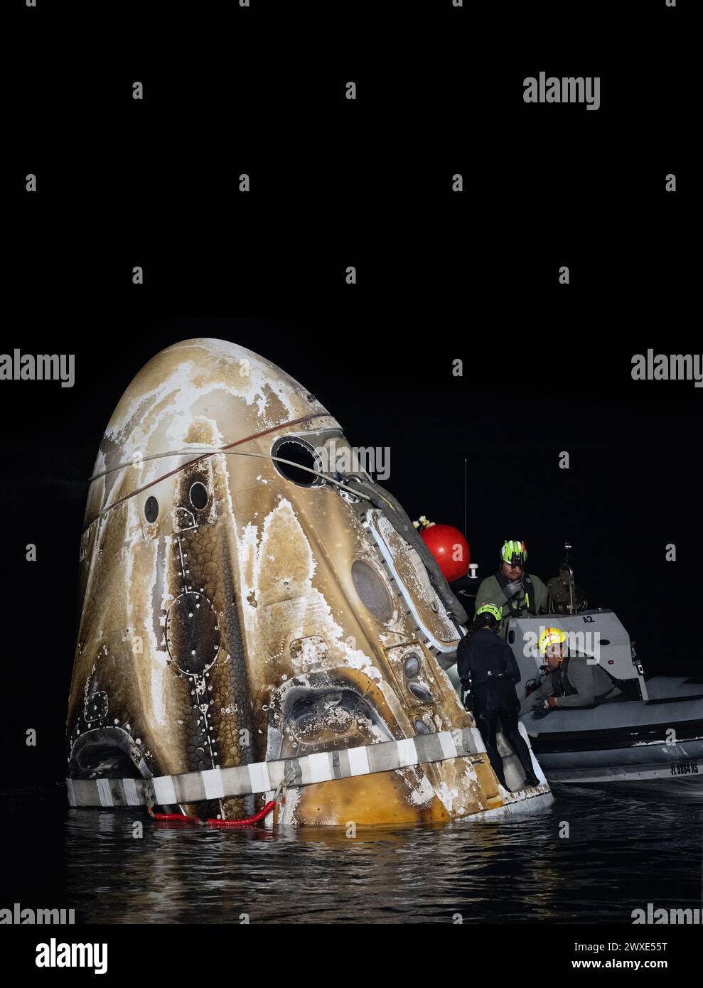 Support teams work around the SpaceX Dragon Endurance spacecraft shortly after it landed with NASA astronaut Jasmin Moghbeli, ESA astronaut Andreas Mogensen, Japan Aerospace Exploration Agency (JAXA) astronaut Satoshi Furukawa, and Roscosmos cosmonaut Konstantin Borisov aboard in the Gulf of Mexico off the coast of Pensacola, Florida, 12  March 2024. Moghbeli, Mogensen, Furukawa, and Borisov are returning after nearly six-months in space as part of Expedition 70 aboard the International Space Station. An optimised and enhanced version of an original  NASA image/ mandatory credit: NASA/JKowsky Stock Photo
